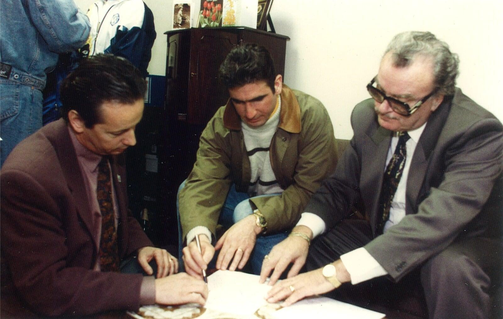 Eric Cantona and Jean-Jacques Bertrand upon signing his contract with Leeds United in February 1992